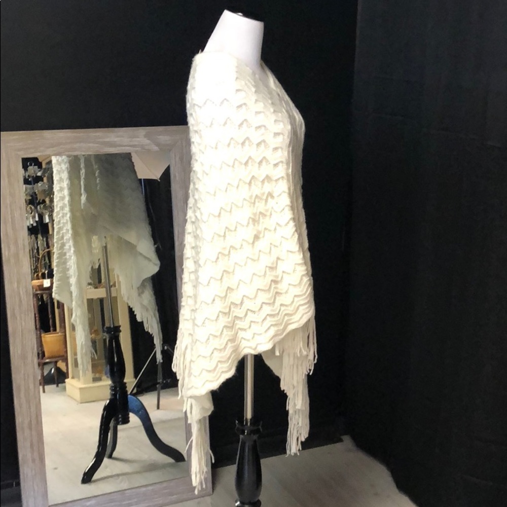 White acrylic pullover poncho with tassel fringe